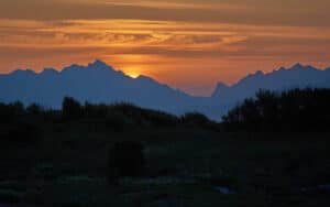 Sustainable Hospitality - Beautiful landscape picture of sun setting over mountains